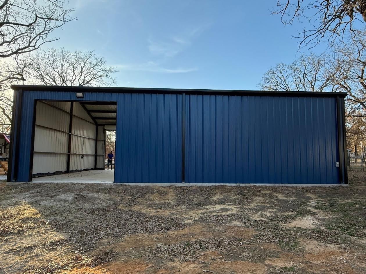 Blue metal commercial building with open sliding door