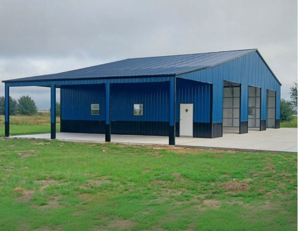 Blue metal commercial building with covered porch and windows