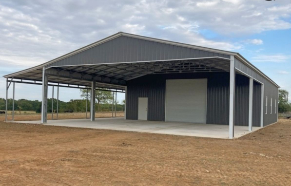 Dark gray metal commercial building with wide lean-to overhang