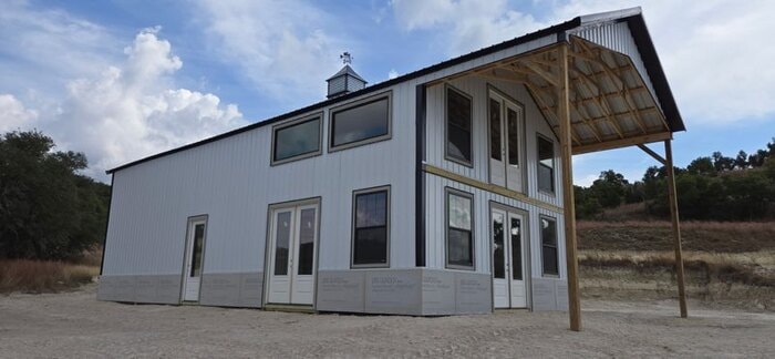 Two-story post frame home under construction